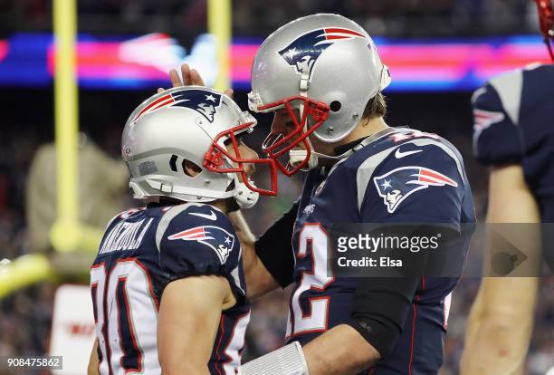 Tom Brady of the New England Patriots celebrates a touchdown with Danny Amendola in the fourth quarter against the Jacksonville Jaguars during the...