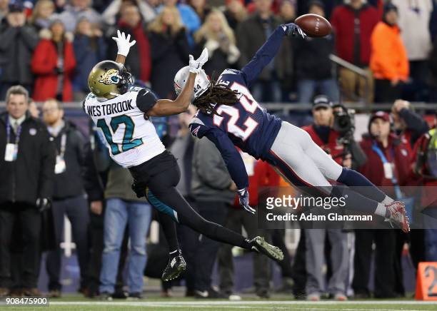 Stephon Gilmore of the New England Patriots deflects a pass intended for Dede Westbrook of the Jacksonville Jaguars in the fouorth quarter during the...