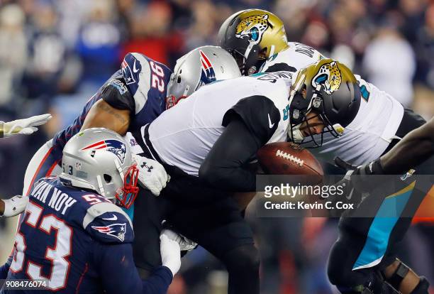 Blake Bortles of the Jacksonville Jaguars is tackled by Kyle Van Noy of the New England Patriots in the fourth quarter during the AFC Championship...