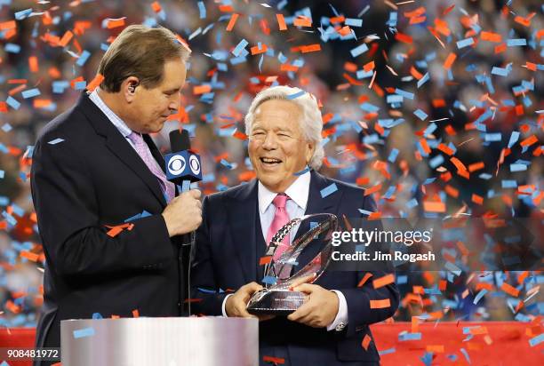 Owner Robert Kraft of the New England Patriots holds the Lamar Hunt trophy as he is interviewed by Jim Nantz after the AFC Championship Game against...