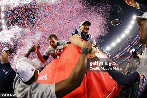 Tom Brady and Danny Amendola of the New England Patriots celebrate after winning the AFC Championship Game against the Jacksonville Jaguars at...