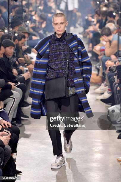 Model walks the runway at the Lanvin Autumn Winter 2018 fashion show during Paris Menswear Fashion Week on January 21, 2018 in Paris, France.