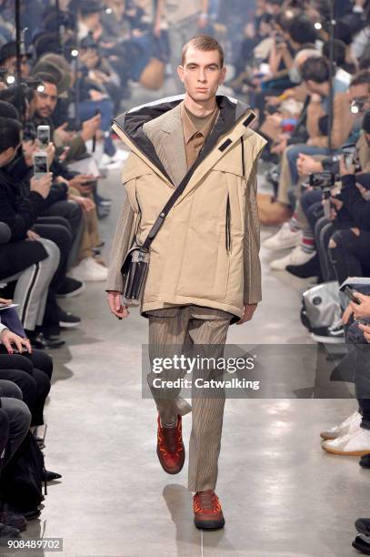 Model walks the runway at the Lanvin Autumn Winter 2018 fashion show during Paris Menswear Fashion Week on January 21, 2018 in Paris, France.