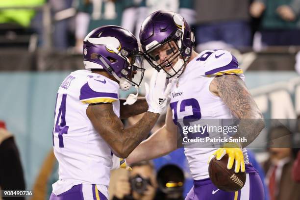 Kyle Rudolph is congratulated by his teammate Stefon Diggs of the Minnesota Vikings after scoring a first quarter touchdown against the Philadelphia...