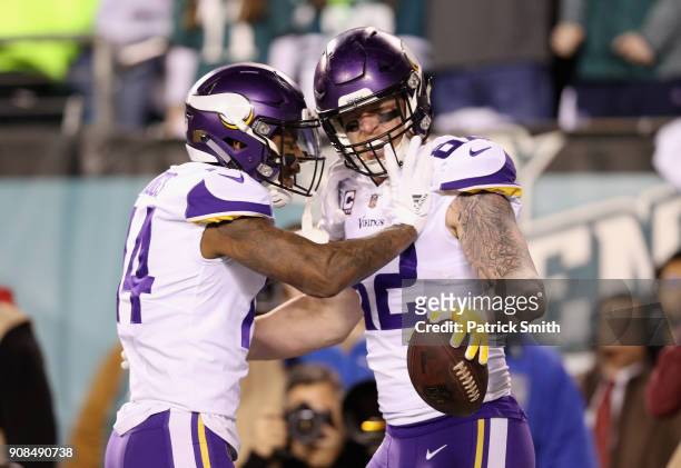 Kyle Rudolph is congratulated by his teammate Stefon Diggs of the Minnesota Vikings after scoring a first quarter touchdown against the Philadelphia...