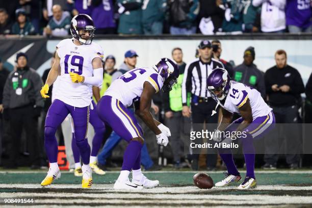 Adam Thielen, Latavius Murray and Stefon Diggs of the Minnesota Vikings celebrate the first quarter touchdown by Kyle Rudolph against the...