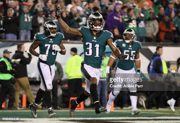 Jalen Mills of the Philadelphia Eagles celebrates a first quarter touchdown by teammate Patrick Robinson against the Minnesota Vikings in the NFC...