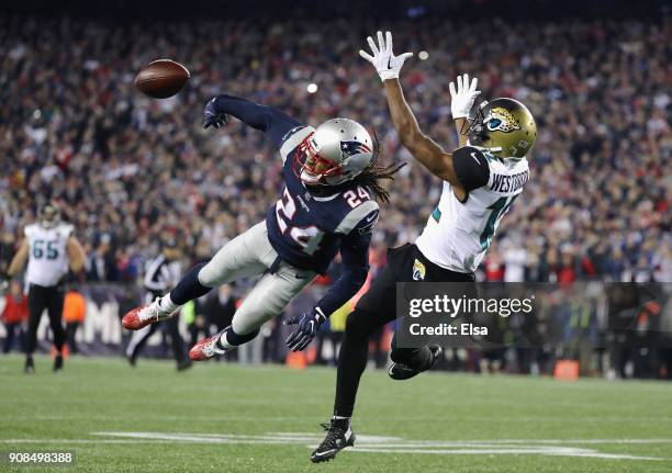 Stephon Gilmore of the New England Patriots deflects a pass intended for Dede Westbrook of the Jacksonville Jaguars in the fouorth quarter during the...