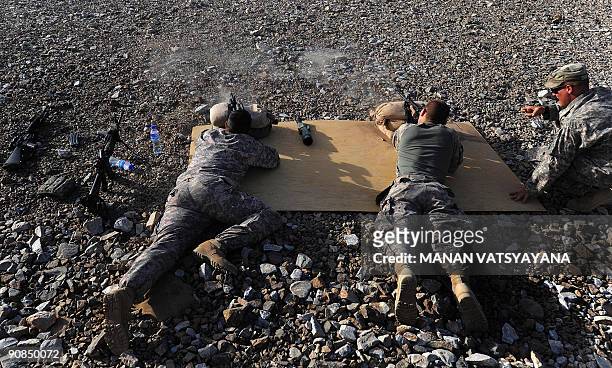 Soldiers from 3rd Platoon Alpha 3-71 Cavalry take part in a zeroing exercise at the Baraki Barak Joint Combat OutPost in Logar Province on August 18,...
