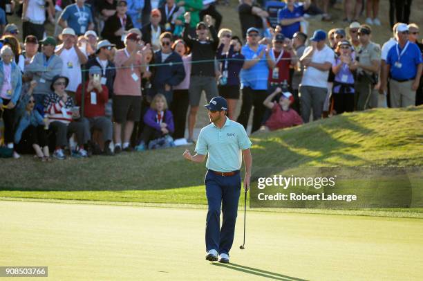 Andrew Landry reacts to his birdie putt to force a playoff on the 18th hole during the final round of the CareerBuilder Challenge at the TPC Stadium...