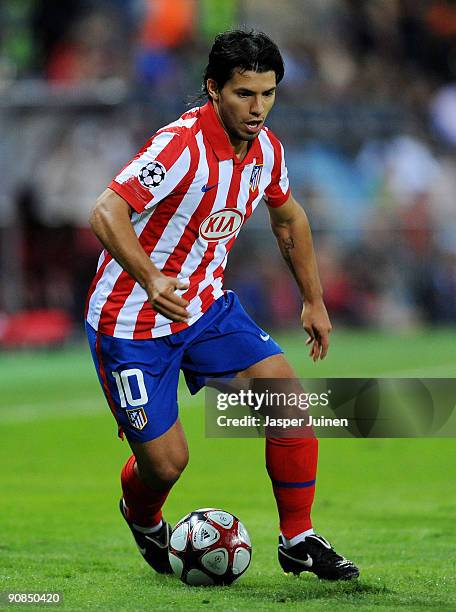 Sergio Aguero of Atletico Madrid runs with the ball during the Champions League group D match between Atletico Madrid and APOEL FC at the Vicente...