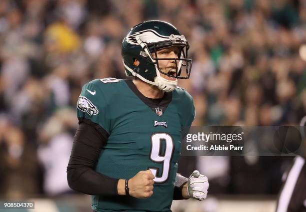 Nick Foles of the Philadelphia Eagles celebrates a second quarter touchdown by teammate LeGarrette Blount against the Minnesota Vikings in the NFC...