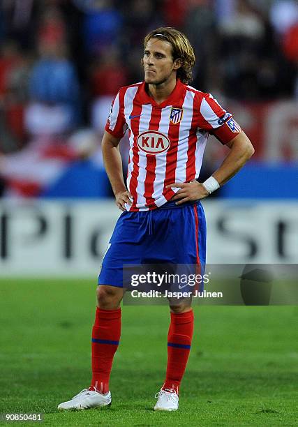 Diego Forlan of Atletico de Madrid stands dejected during the Champions League group D match between Atletico Madrid and APOEL FC at the Vicente...