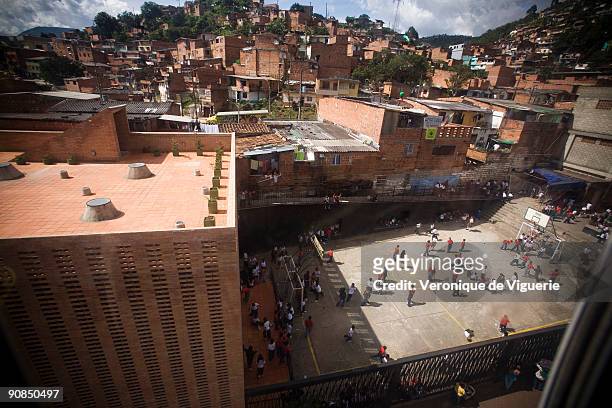 The poor neighborhoods of Medellin, at the foot of the mountains, are linked to the centre by cable car.
