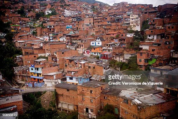 The poor neighborhoods of Medellin, at the foot of the mountains, are linked to the centre by cable car.