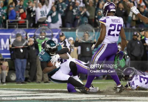 LeGarrette Blount of the Philadelphia Eagles scores a second quarter touchdown past Harrison Smith of the Minnesota Vikings in the NFC Championship...