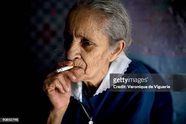 Margarita is nicknamed 'the witch'. She has lived in the Popular neighborhood for 20 years, located at the top of the mountain, by the final cable...