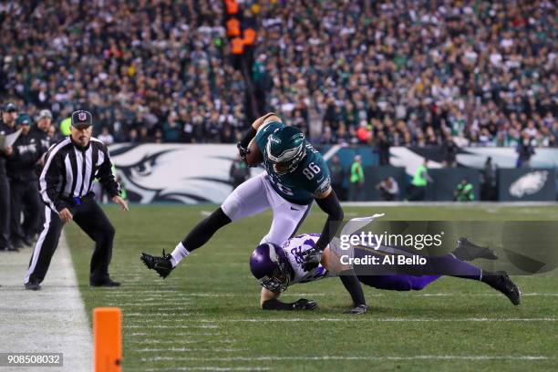 Zach Ertz of the Philadelphia Eagles makes a catch under pressure from Harrison Smith of the Minnesota Vikings during the second quarter in the NFC...