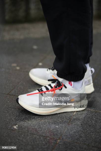 Guest wears Virgil Abloh x Nike Ten Nike Icons "FOAM" sneakers on January 21, 2018 in Paris, France.