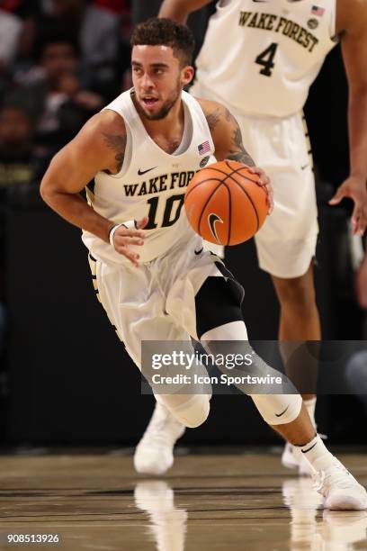 Wake Forest Demon Deacons guard Mitchell Wilbekin brings the ball up court against the Virginia Cavaliers during the ACC matchup on January 21, 2018...