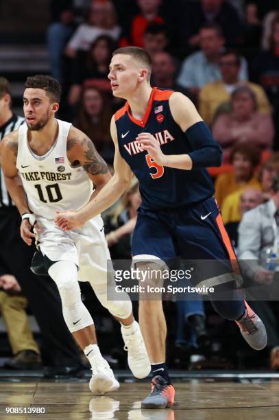 Virginia Cavaliers guard Kyle Guy waits for a pass covered by Wake Forest Demon Deacons guard Mitchell Wilbekin during the ACC matchup on January 21,...