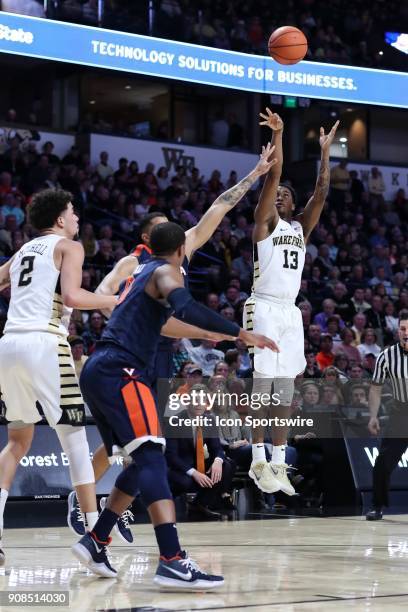 Wake Forest Demon Deacons guard Bryant Crawford takes a long jumper against the Virginia Cavaliers during the ACC matchup on January 21, 2018 between...