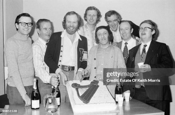 Irish folk group The Chieftains celebrating a special occasion with BBC radio and TV presenter 'Whispering' Bob Harris , 1976. Left to right: Michael...