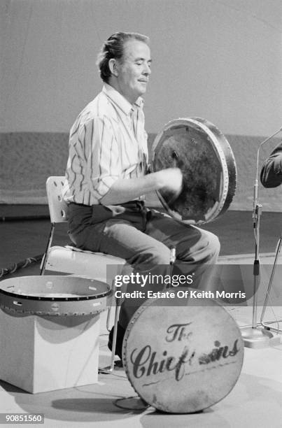 Bodhran player Peadar Mercier of Irish folk group The Chieftains, performing on a TV show, 1976.