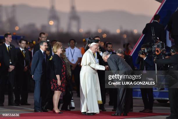 Pope Francis is greeted by Peru's President Pedro Pablo Kuczynski before boarding the plane back to Rome, at Lima's airport on January 21, 2018. -...