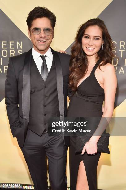 Actos John Stamos and Caitlin McHugh attend the 24th Annual Screen Actors Guild Awards at The Shrine Auditorium on January 21, 2018 in Los Angeles,...