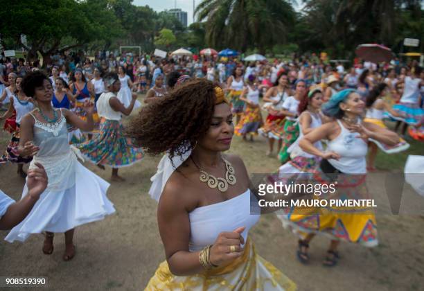 Revellers of the street carnival group Tambores de Olokun perform during a pre-carnival street party at Flamengo Park in Rio de Janeiro, Brazil, on...