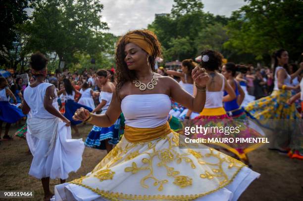 Revellers of the street carnival group Tambores de Olokun perform during a pre-carnival street party at Flamengo Park in Rio de Janeiro, Brazil, on...