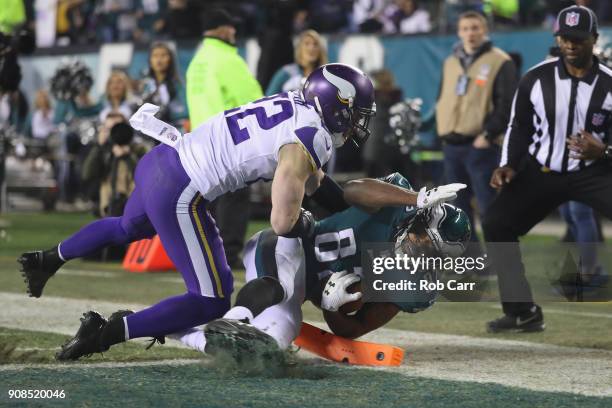 Torrey Smith of the Philadelphia Eagles scores a third quarter touchdown past Harrison Smith of the Minnesota Vikings in the NFC Championship game at...