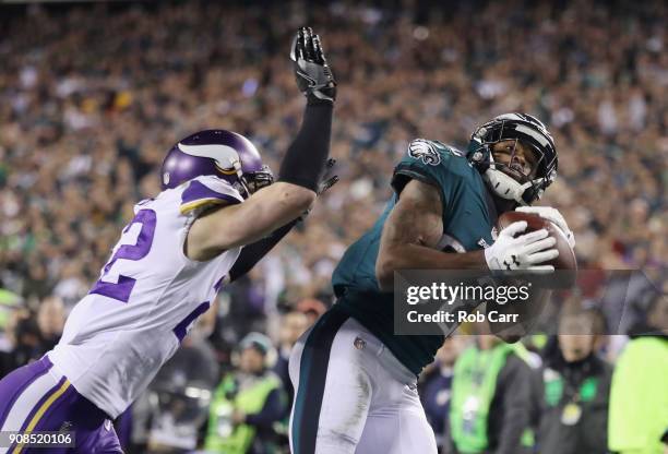 Torrey Smith of the Philadelphia Eagles scores a third quarter touchdown past Harrison Smith of the Minnesota Vikings in the NFC Championship game at...