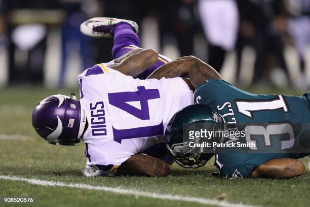 Stefon Diggs of the Minnesota Vikings is tackled by Jalen Mills of the Philadelphia Eagles during the second quarter in the NFC Championship game at...