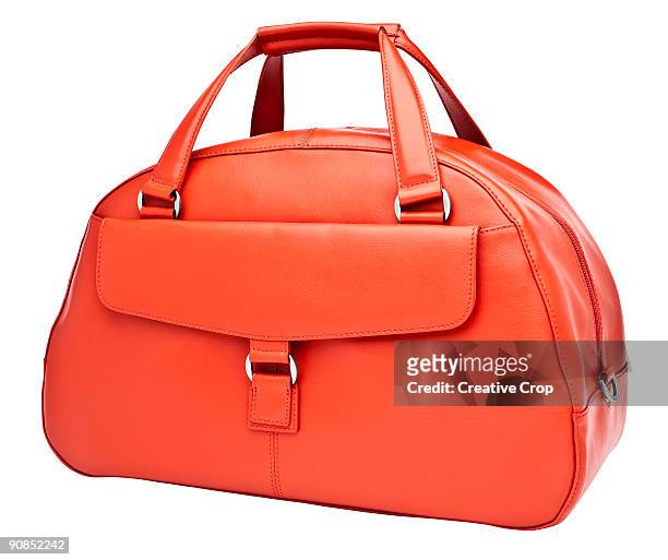 luxury woman's orange leather handbag - bolso fotografías e imágenes de stock
