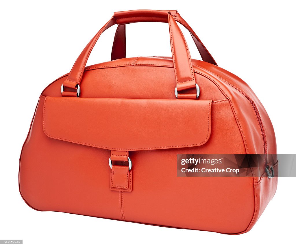 Luxury woman's orange leather handbag