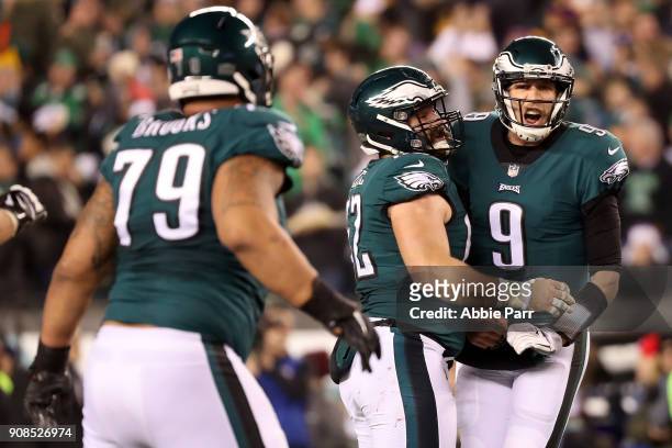Nick Foles of the Philadelphia Eagles is congratulated by his teammate Najee Goode after scoring a touchdown against the Minnesota Vikings during the...