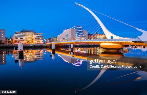 samuel beckett bridge at dusk in dublin city, ireland - national convention stock pictures, royalty-free photos & images