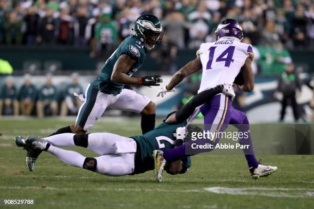 Stefon Diggs of the Minnesota Vikings attempts to get past the tackle attempt of Rodney McLeod of the Philadelphia Eagles during the first quarter in...