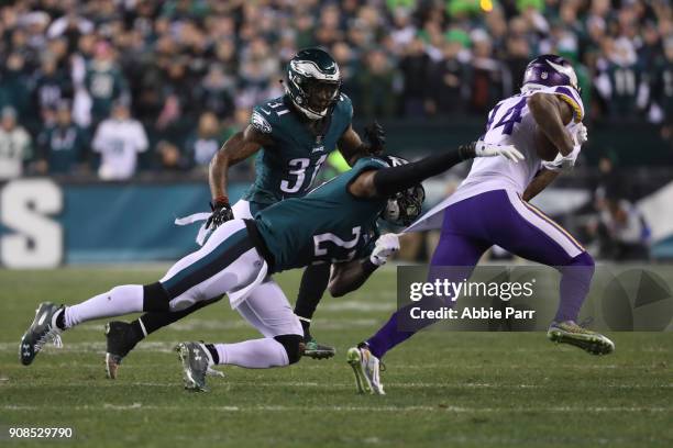 Stefon Diggs of the Minnesota Vikings attempts to get past the tackle attempt of Rodney McLeod of the Philadelphia Eagles during the first quarter in...