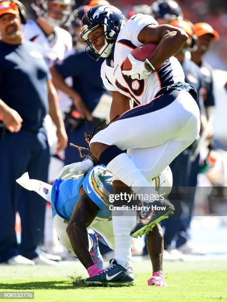 Bennie Fowler III of the Denver Broncos is tackled by Jahleel Addae of the Los Angeles Chargers at StubHub Center on October 22, 2017 in Carson,...