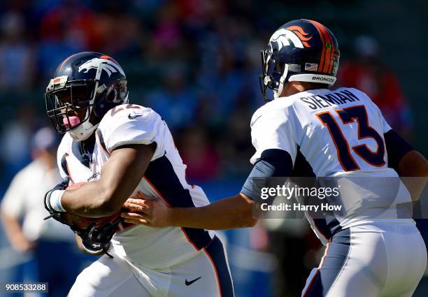 Anderson of the Denver Broncos takes a handoff from Trevor Siemian during the game against the Los Angeles Chargers at StubHub Center on October 22,...
