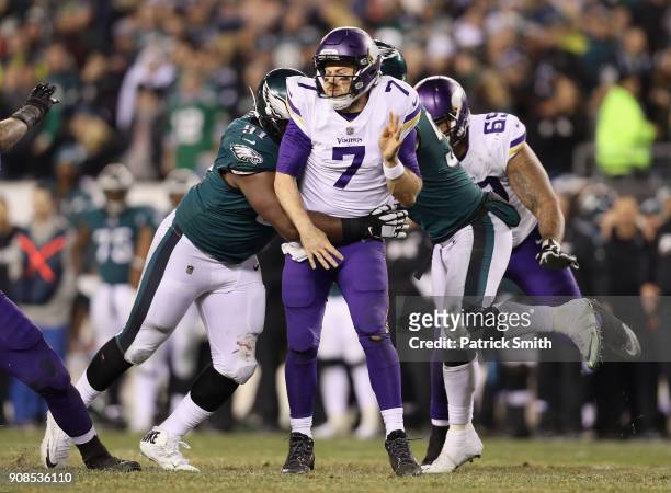 Case Keenum of the Minnesota Vikings is tackled by Fletcher Cox of the Philadelphia Eagles during the fourth quarter in the NFC Championship game at...