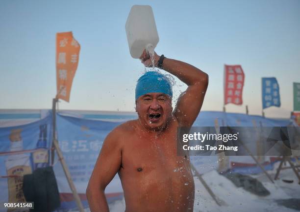 Winter swimmer rinses off near the SongHua River as recent temperatures dropped to as low as -35 C on January 22, 2018 in Harbin, China.