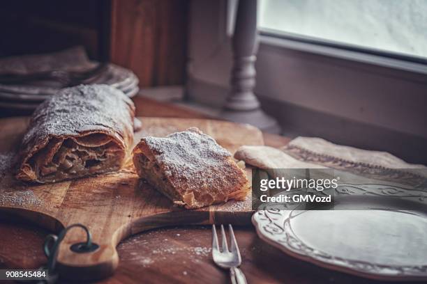 homemade apfelstrudel with powdered sugar - strudel stock pictures, royalty-free photos & images