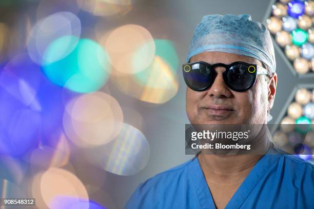 Surgeon Shafi Ahmed poses for a photograph wearing a pair of Snap Inc. Spectacles inside his operating theater at the Royal London Hospital, part of...