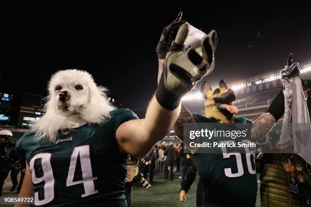 Beau Allen and Chris Long of the Philadelphia Eagles celebrates their teams win while wearing a dog masks over the Minnesota Vikings in the NFC...