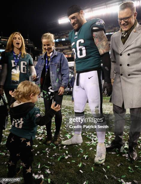 Chris Long of the Philadelphia Eagles celebrates with his son Waylon James Long and his father and former NFL player Howie Long after defeating the...