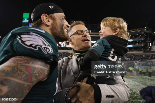 Chris Long of the Philadelphia Eagles celebrates with his son Waylon James Long and his father and former NFL player Howie Long after defeating the...
